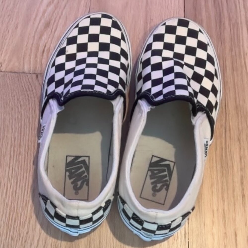 Van's checker board shoes, Size 8 in women's, and the colors are black and white